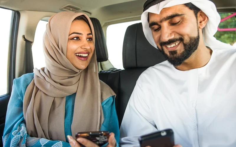 arabic couple driving in a car